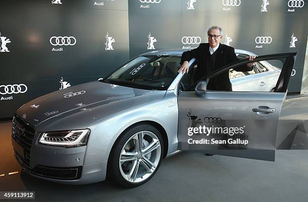 Dieter Kosslick, Director of the Berlinale International Film Festival, poses in front of an Audi limousine at Audi City Berlin on November 18, 2013...