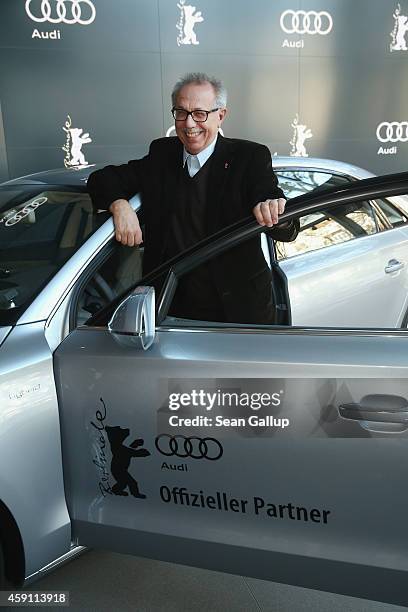 Dieter Kosslick, Director of the Berlinale International Film Festival, poses in front of an Audi limousine at Audi City Berlin on November 18, 2013...