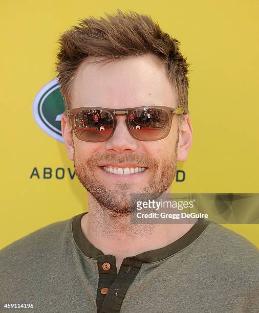 Joel McHale arrives at the P.S. ARTS Express Yourself 2014 at The Barker Hanger on November 16, 2014 in Santa Monica, California.