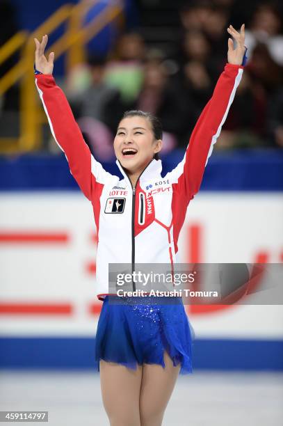 Kanako Murakami of Japan waves for fans during the All Japan Figure Skating Championships at Saitama Super Arena on December 23, 2013 in Saitama,...