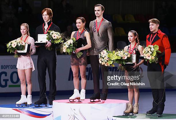 The winners of the Pair competition from left to right are, Silver medalist from Russia Evgenia Tarasova and Vladimir Morozov, Gold metalist from...