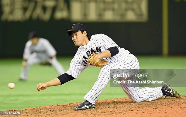 Kazuhisa Makita of Samurai Japan throws during the game three of Samurai Japan and MLB All Stars at Tokyo Dome on November 15, 2014 in Tokyo, Japan.