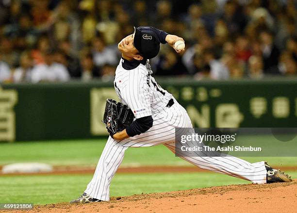 Starting pitcher Takahiro Norimoto of Samurai Japan delivers a pitch during the game three of Samurai Japan and MLB All Stars at Tokyo Dome on...