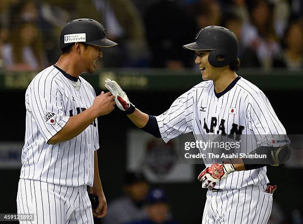 Hayato Sakamoto of Samurai Japan celebrates his two-run homer with Sho Nakata in the bottom of 2nd inning during the game three of Samurai Japan and...