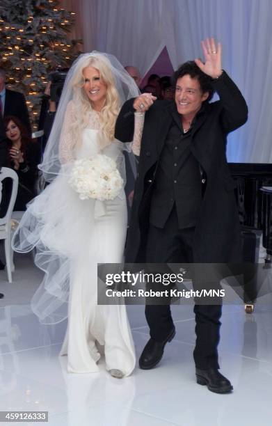 Michaele Schon and Neal Schon attend their wedding at the Palace of Fine Arts on December 15, 2013 in San Francisco, California.