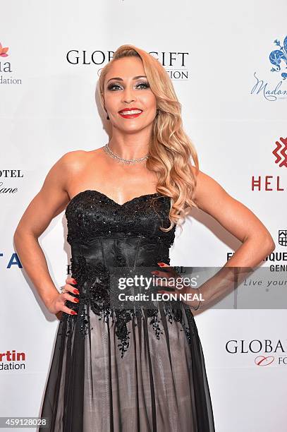 Dancer Iveta Lukosiute poses as she arrives at the 5th annual London Global Gift Gala in London on November 17, 2014. Global Gift Galas aim to engage...