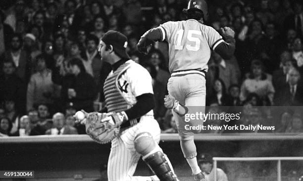 New York Yankees vs Kansas City Royals Yank Thurman Munson is left holding the bag and ball as Darrell Porter scores in third inning.