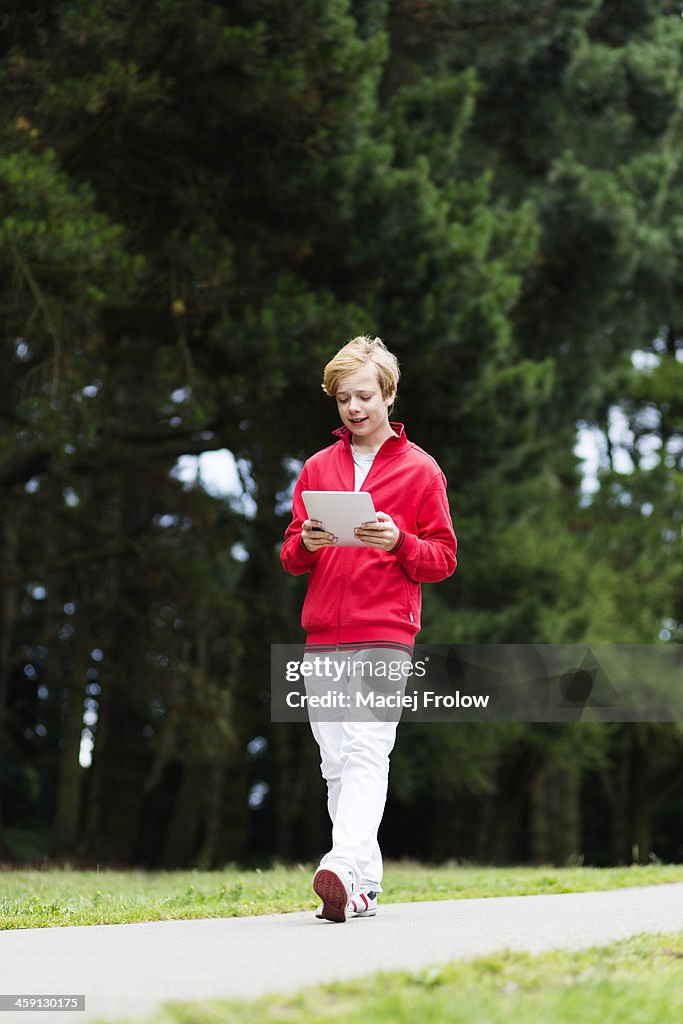 Boy walking in a park