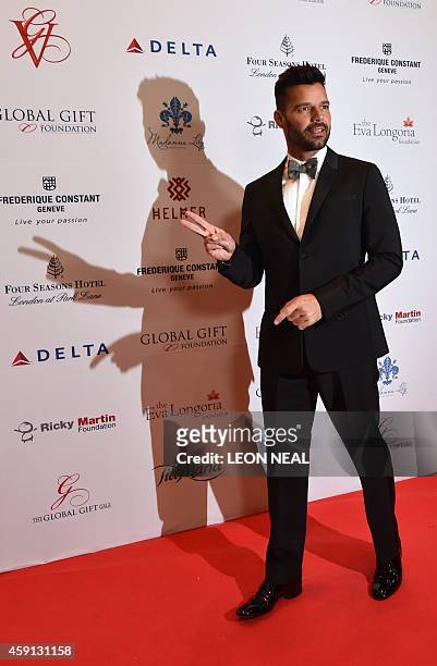 Puerto Rican pop musician Ricky Martin poses as he arrives at the 5th annual London Global Gift Gala in London on November 17, 2014. Global Gift...