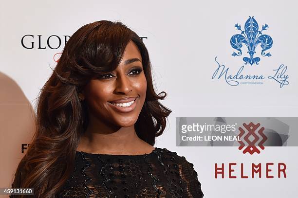 British singer Alexandra Burke poses as she arrives at the 5th annual London Global Gift Gala in London on November 17, 2014. Global Gift Galas aim...