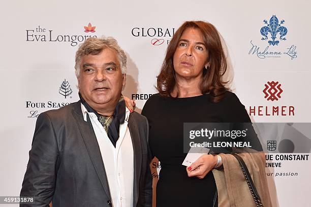 French-born musician Nicolas Reyes poses with a guest as he arrives at the 5th annual London Global Gift Gala in London on November 17, 2014. Global...