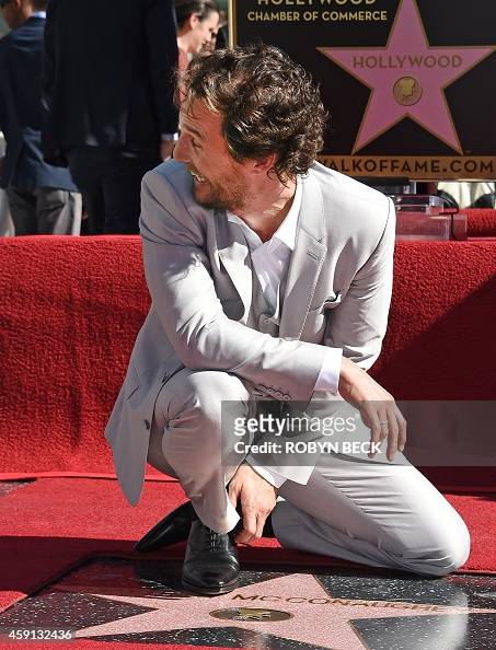 Actor Matthew McConaughey smiles and looks back toward his family ...