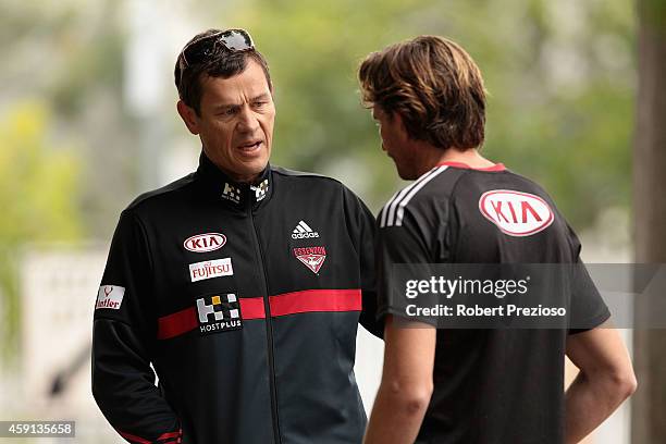 Assistant Coach Mark Harvey speaks with Coach James Hird during an Essendon Bombers AFL pre-season training session at Princes Park on November 18,...