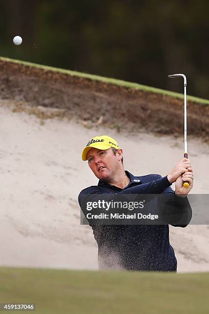 Jarrod Lyle of Australia hits out of a bunker ahead of the 2014 Australian Masters at The Metropolitan Golf Course on November 18, 2014 in Melbourne,...