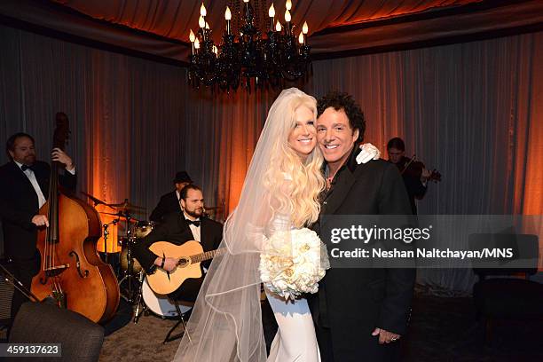 Michaele Schon and Neal Schon attend their wedding at the Palace of Fine Arts on December 15, 2013 in San Francisco, California.