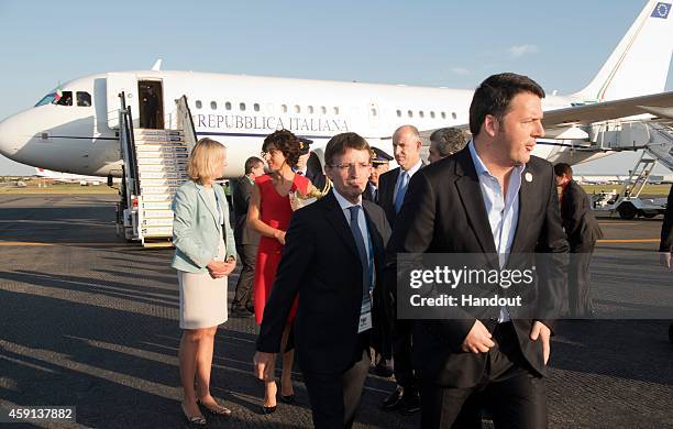 In this handout photo provided by the G20 Australia, Italy's Prime Minister Matteo Renzi arrives with his wife Mrs Agnese Landini at G20 Terminal on...