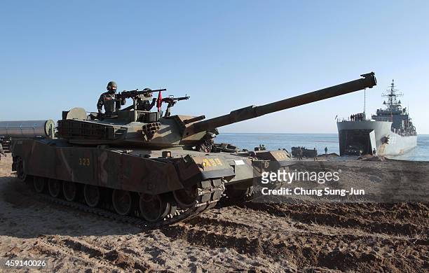 South Korea's K1 battle tank moves into position during the U.S. And South Korean Marines joint landing operation at Pohang seashore on November 18,...