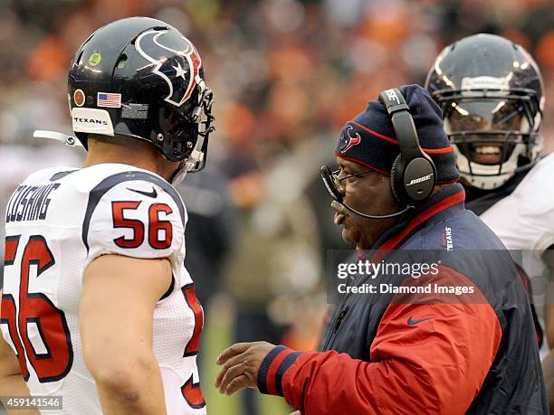 Defensive coordinator Romeo Crennel of the Houston Texans talks with linebacker Brian Cushing on the sideline during a game against the Cleveland...