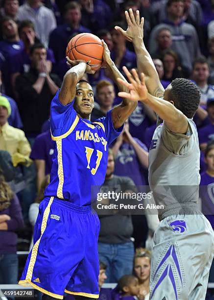 Guard Frank Williams Jr. #13 of the UMKC Roos hits a three-point shot against the Kansas State Wildcats during the first half on November 17, 2014 at...