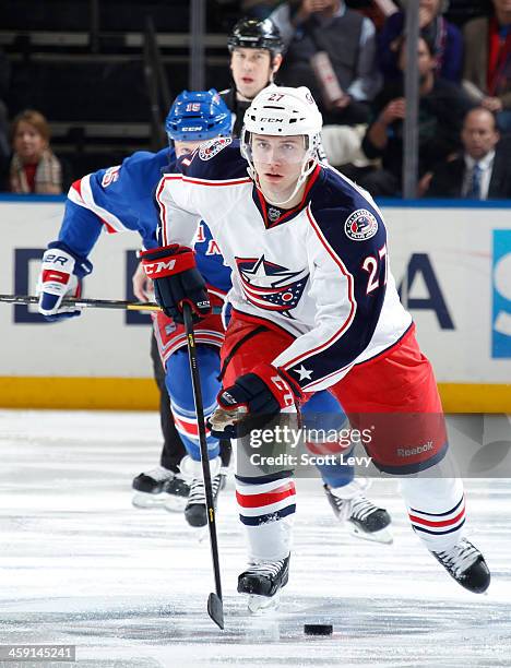 Ryan Murray of the Columbus Blue Jackets skates the puck up the ice against the New York Rangers at Madison Square Garden on December 12, 2013 in New...