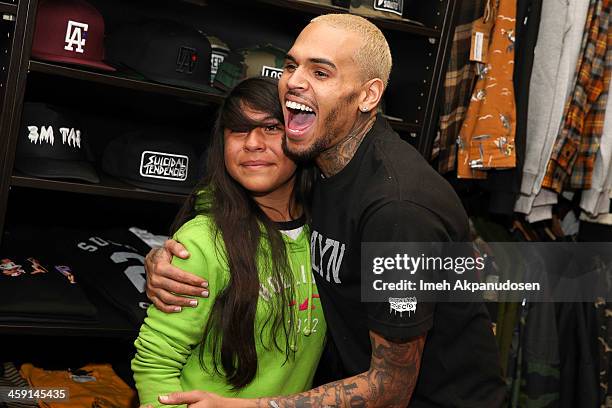 Singer Chris Brown greets fans at the 1st Annual Xmas Toy Drive hosted by himself and Brooklyn Projects on December 22, 2013 in Los Angeles,...