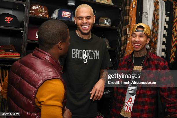 Comedian Kevin Hart, singer Chris Brown, and rapper Tyga attend the 1st Annual Xmas Toy Drive hosted by Chris Brown and Brooklyn Projects on December...