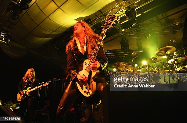 Guitarists Chris Caffery and Joel Hoekstra of Trans-Siberian Orchestra perform onstage during an exclusive performance at The iHeartRadio Theater in...