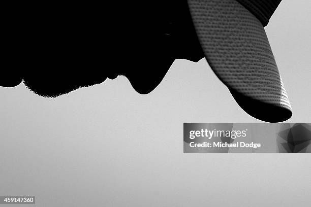 Adam Scott of Australia looks down as he putts on the practice green ahead of the 2014 Australian Masters at The Metropolitan Golf Course on November...