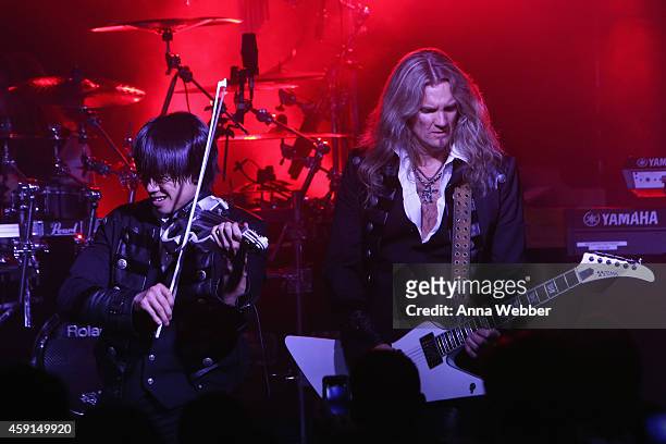 Violinist Roddy Chong and guitarist Joel Hoekstra of Trans-Siberian Orchestra perform onstage during an exclusive performance at The iHeartRadio...