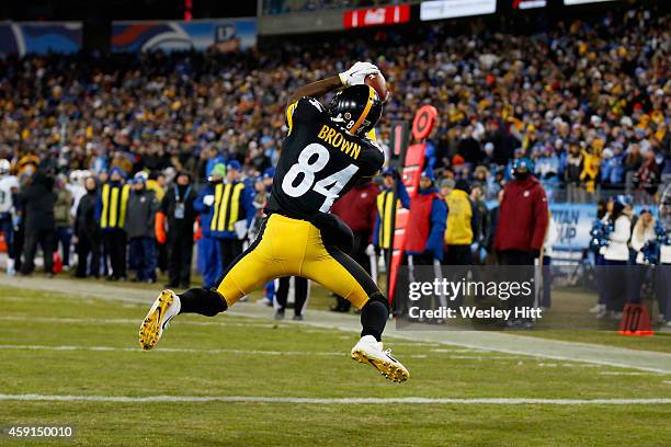 Antonio Brown of the Pittsburgh Steelers catches a pass to run 12 yards for a touchdown against the Tennessee Titans in the fourth quarter of the...