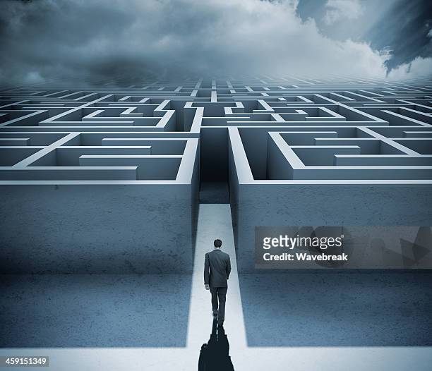 businessman getting in a maze - challenge stock pictures, royalty-free photos & images