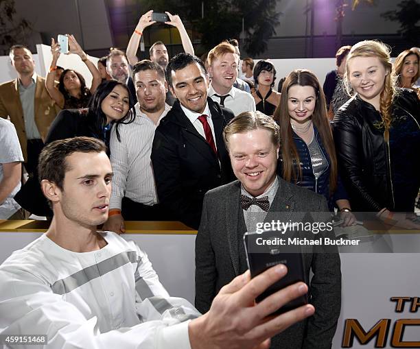 Fans take a Wide Angle Selfie with actor Elden Henson using the new Samsung Galaxy Note 4 at the release of The Hunger Games: Mockingjay - Part 1 on...