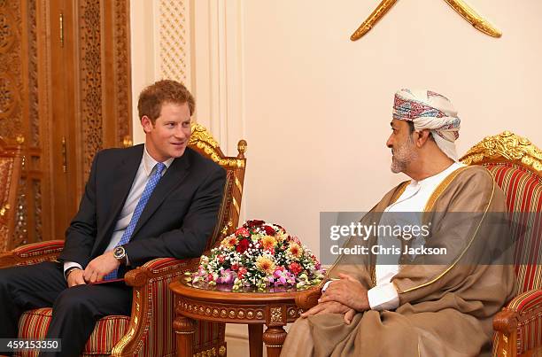 Prince Harry chats to the Sultan of Oman's First Cousin His Highness Sayyid Haithem Bin Tariq Al Said as he arrives at the VIP section of Muscat...