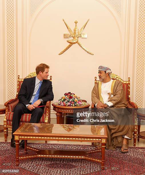 Prince Harry chats to the Sultan of Oman's First Cousin His Highness Sayyid Haithem Bin Tariq Al Said as he arrives at the VIP section of Muscat...