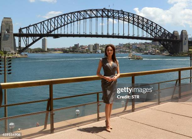 Hollywood star Angelina Jolie poses for photos in front of Australia's iconic landmark Harbour Bridge after the world premiere of her World War II...