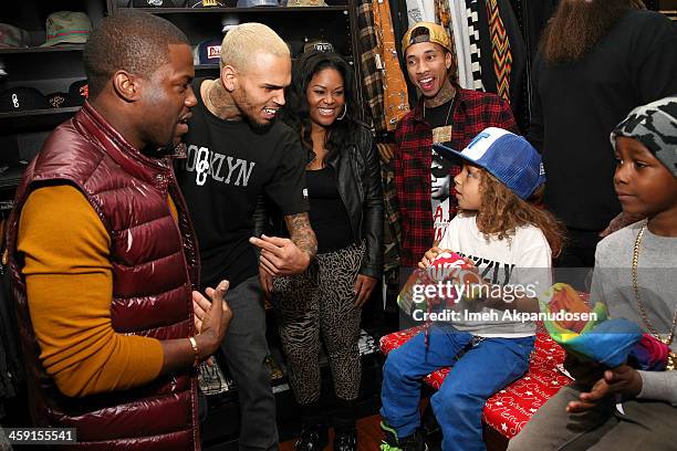 Singer Chris Brown, comedian Kevin Hart, and rapper Tyga attend the 1st Annual Xmas Toy Drive hosted by Chris Brown and Brooklyn Projects on December...