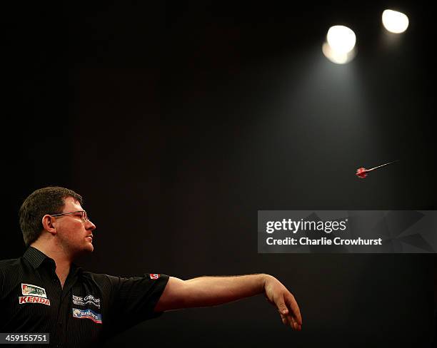 James Wade of England in action during his second round match against Andy Smith of England during the Ladbrokes.com World Darts Championship on Day...