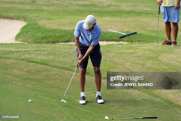 President Barack Obama plays golf at Mid-Pacific Country Club in Kailua, Hawaii 2013. The first family is in Hawaii for their annual winter holiday...