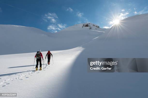 ski touring in the eternal ice - heli skiing stock pictures, royalty-free photos & images