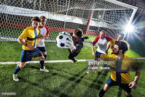 football match in stadium: goalkeeper save - verdediger voetballer stockfoto's en -beelden