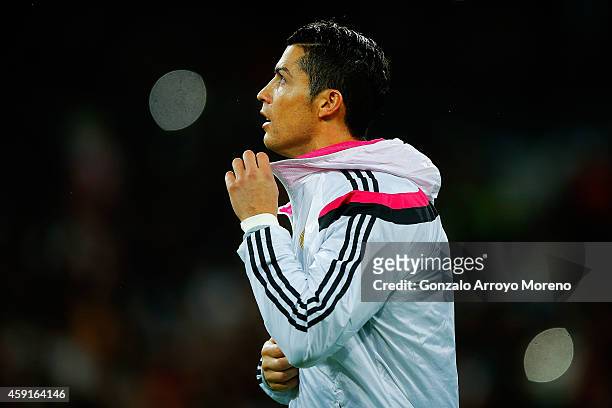 Cristiano Ronaldo of Real Madrid CF opens his jacket as he enters the pitch prior to start the La Liga match between Real Madrid CF and Rayo...