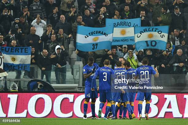 Carlos Tevez of Juventus FC celebrates a goal with team-mates during the Serie A match between Juventus FC and Parma FC at Juventus Arena on November...