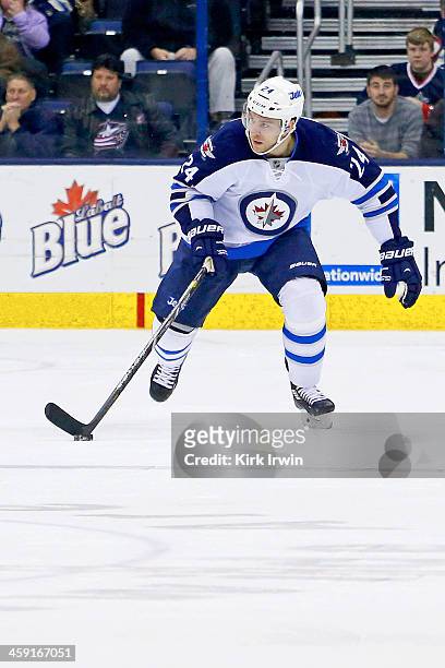 Grant Clitsome of the Winnipeg Jets controls the puck during the game against the Columbus Blue Jackets on December 16, 2013 at Nationwide Arena in...