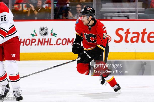 David Jones of the Calgary Flames skates against the Carolina Hurricanes at Scotiabank Saddledome on December 12, 2013 in Calgary, Alberta, Canada....