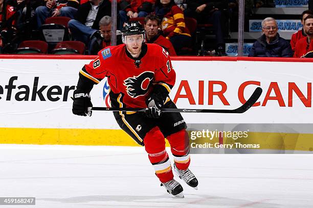 Matt Stajan of the Calgary Flames skates against the Carolina Hurricanes at Scotiabank Saddledome on December 12, 2013 in Calgary, Alberta, Canada....