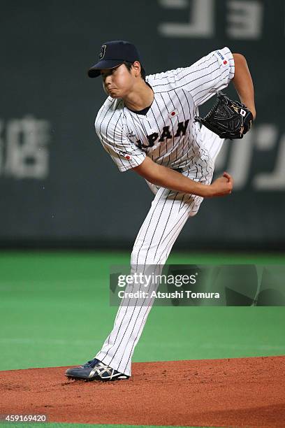 Starting pitcher Shohei Otani of Samurai Japan pitches in the first inning during the game five of Samurai Japan and MLB All Stars at Sapporo Dome on...