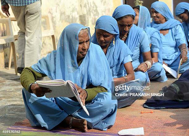 To go with story 'India-health-social-toilets' In this photograph taken on November 13, 2014 Indian woman Kela Devi attends a class in writing and...