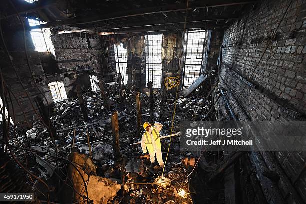 Forensic archaeologists Owen Godbert begins sifting through the ashes of the fire damaged Mackintosh Library at the Glasgow School of Art on November...