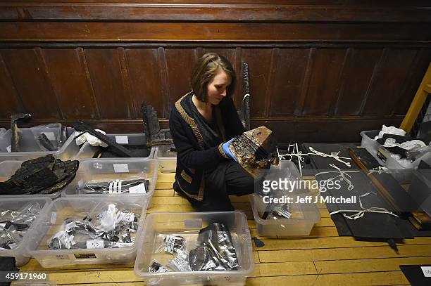 Forensic archaeologists begin sifting through the ashes of the fire damaged Mackintosh Library at the Glasgow School of Art on November 18, 2014 in...