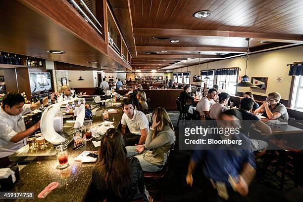 Patrons dine inside a Red Lobster restaurant in Sao Paulo, Brazil, on Saturday, Nov. 15, 2014. After some chains failed in their previous attempts to...